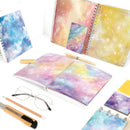Colorful spiral-bound notebooks with galaxy design on a white background