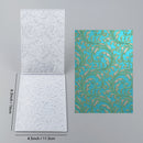 Two embossed paper sheets with patterns and measurements on a gray background