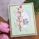Handmade card with floral design and 'You're doing great' message on a textured background.