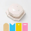 Decorative paper punch with cut-out letters on a white background