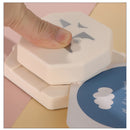 Hexagonal stamp with a cartoon character on a colorful background