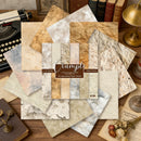 Collection of vintage-style scrapbooking paper sheets on a wooden surface with books and a typewriter.