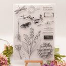 Clear stamp set with various designs including flowers, arrows, and musical notes on a white background.