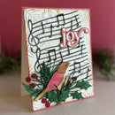 Greeting card with musical notes, a bird, and the word 'joy' on a textured background.