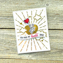 Card with heart and mouse design on a wooden surface