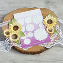 Card with sunflower decorations on a wooden surface