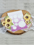Card with sunflower decorations on a wooden surface
