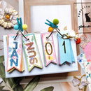 Colorful calendar cards with letters on a white surface