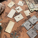 Decorative metal tags on a textured surface with floral designs