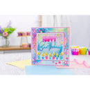 Colorful birthday card with candles and 'Happy Birthday' text on a white surface.