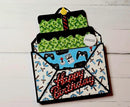 Greeting card with pixelated design and 'Happy Birthday' text on a white wooden background
