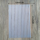 Rectangular white mat with dimensions on a wooden surface