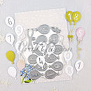 Metal die cut shapes with numbers and decorative elements on a light gray background