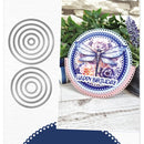 Decorative plate with dragonfly design and 'Happy Birthday' text, surrounded by plants on a wooden surface.