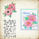 Floral stamp set with pink flowers and metal dies on a textured background