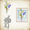 Floral design with butterfly, framed artwork, and metal cutting dies on a textured background