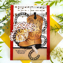 Card with cowboy boot, flowers, and music sheet design on a decorative background.