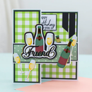 Birthday card with champagne bottle and glasses on a green checkered background