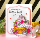 Greeting card with a berry-themed design and text 'Wishing you the berry best' on a striped background.