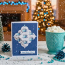 Blue card with decorative design and text 'Sweet Winter Vibes' next to a teal mug with hot chocolate and marshmallows, set against a festive background.