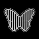 Butterfly-shaped metal grille on a black background
