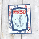 Card with anchor design and 'Anchor' text on a light wooden background