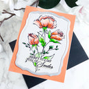 Greeting card with floral design and text on a marble surface