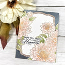 Floral card with text 'Hope this brings a little happiness' on a wooden surface with flowers.