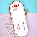 Letter with 'Mail' and 'Naughty or Nice' text on a blue and pink background with decorative elements.