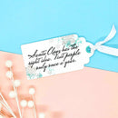 Gift tag with humorous text on a light blue and pink background
