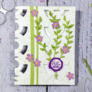 Card with floral design and 'Helle' stamp on a textured surface