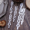 Metallic 'Happy Birthday' letter cutouts on a wooden surface