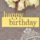 Happy Birthday card with flowers and decorative text on a gray background