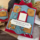 Christmas card with decorative elements on a wooden surface
