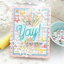 Colorful birthday card with decorative elements on a light background