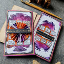 Two artistic greeting cards with decorative elements on a textured surface.