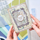 Hand holding a decorative card with 'Thank you so much' text against a colorful background.