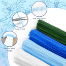 Set of blue, green, and white straws with close-up details on a floral background