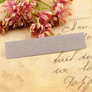 Decorative lace bookmark on an old letter with pink flowers