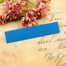 Blue embossed strip on an old letter with pink flowers