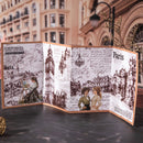 Decorative book with illustrations and text on a city street background
