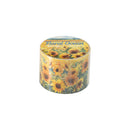 Candle with sunflower design and 'Floral Ocean' text on a white background