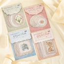 Four packages of Glazed Tulle lace with floral designs on a soft beige background.