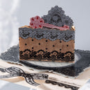 Decorative box with lace detailing on a white background