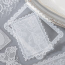 Lace doilies on a gray surface with a decorative edge.