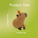 Crocheted capybara toy with carrot on a green background, showing product size measurements.