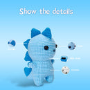 Crocheted blue creature with labeled parts on a blue background