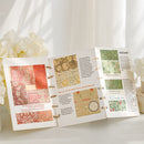 Open book with patterned pages on a white surface