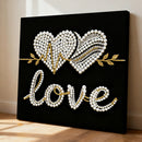 Decorative wall art with heart designs and the word 'love' on a black background.