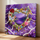 Decorative wall art with a heart-shaped frame, butterflies, and flowers on a purple background.